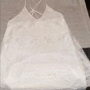 A white laced knee length dress